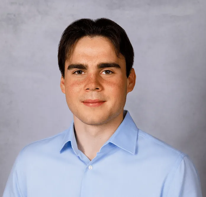 a head shot of Alex Bowker