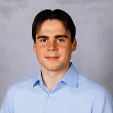 a head shot of Alex Bowker
