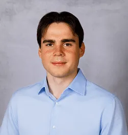 a head shot of Alex Bowker