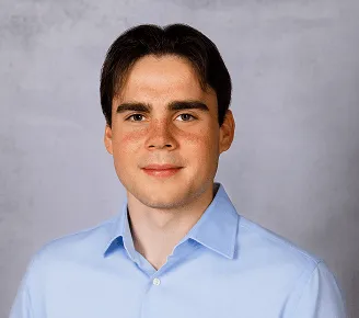 a head shot of Alex Bowker
