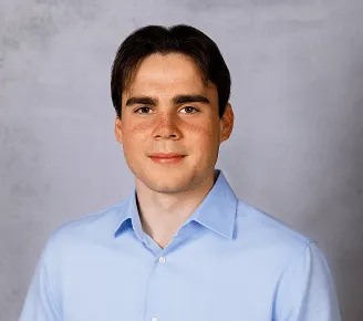 a head shot of Alex Bowker