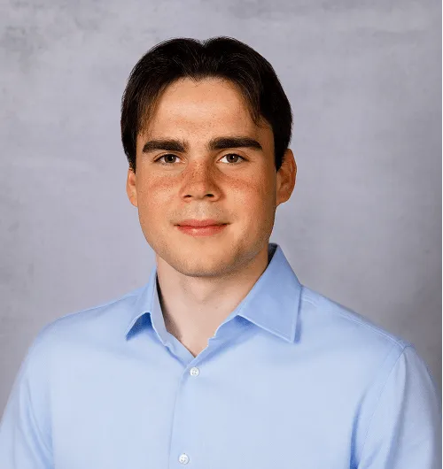 a head shot of Alex Bowker