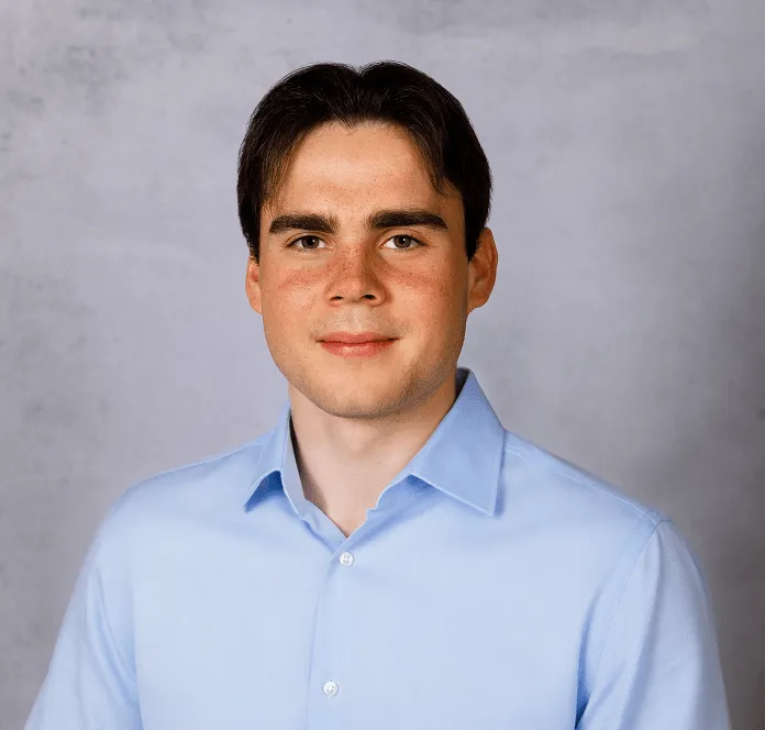 a head shot of Alex Bowker