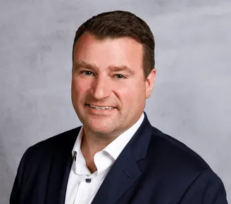 a head shot of Alex Zarycki