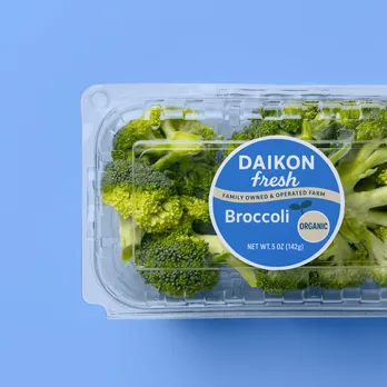 Fresh broccoli package with blue circular product label