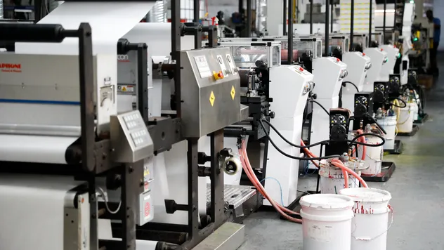 Clean manufacturing equipment and workers in solvent-free production environment