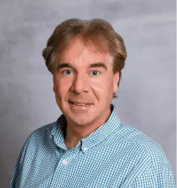 a head shot of Ed Griger