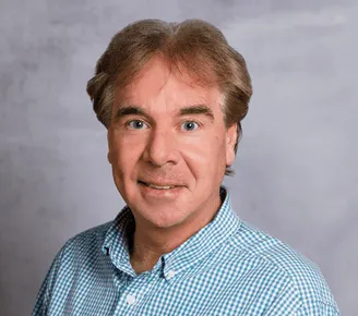a head shot of Ed Griger