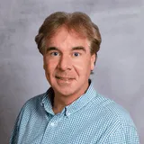 a head shot of Ed Griger