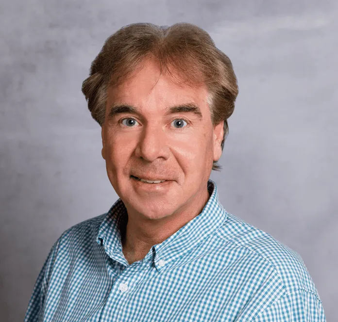 a head shot of Ed Griger