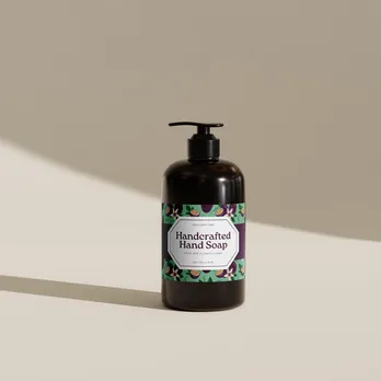 Black hand soap bottle with colorful digitally printed botanical label