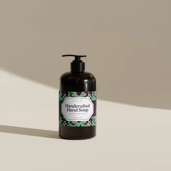 Handcrafted soap bottle with decorative label