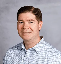 a head shot of Mike Reese