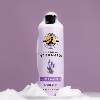 Purple shampoo bottle with lavender label against purple background