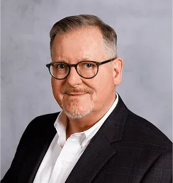 a head shot of Stuart Reid