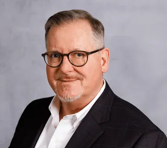 a head shot of Stuart Reid