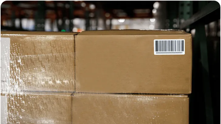 shrinkwrapped cardboard boxes on a pallet
