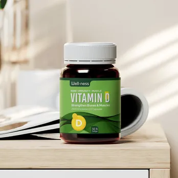 Green vitamin D bottle with clear label and supplement pills